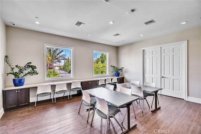 dining room with dark hardwood / wood-style floors