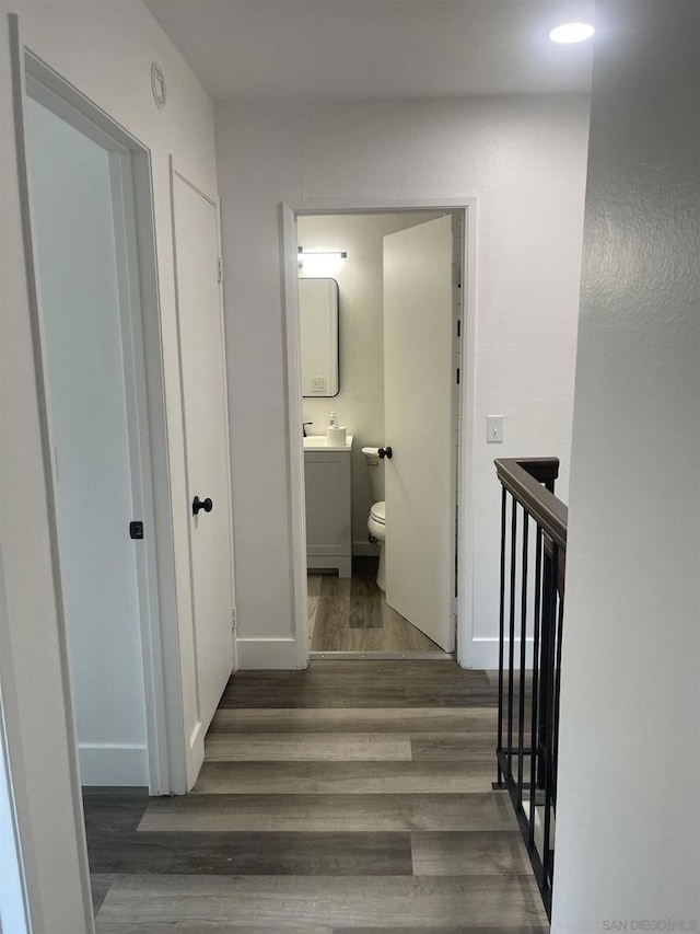 hall with dark wood-type flooring