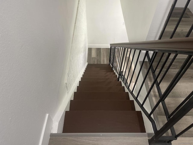 stairway featuring hardwood / wood-style floors