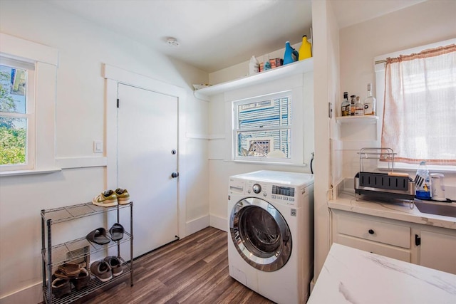 washroom with washer / dryer and dark wood-type flooring