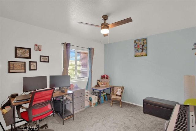 home office with a ceiling fan and carpet floors