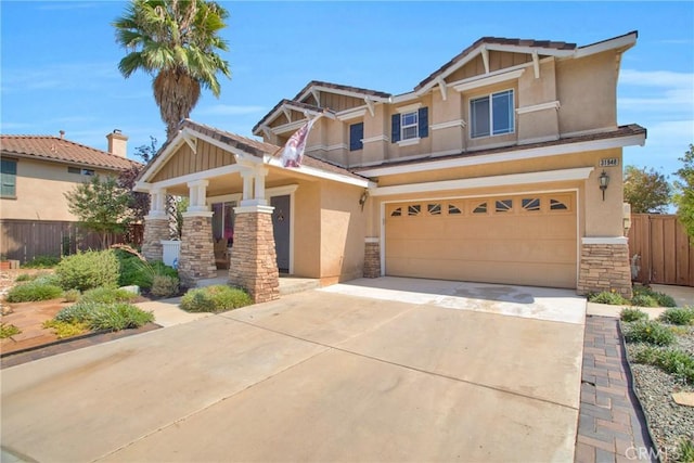 craftsman-style home featuring stucco siding, fence, concrete driveway, and stone siding