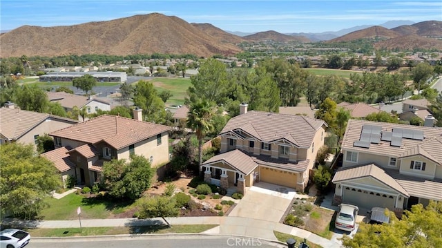 aerial view of residential area with a mountainous background