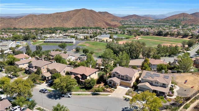 aerial view of residential area featuring a mountainous background