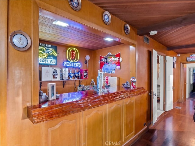 bar with hardwood / wood-style floors and wood ceiling