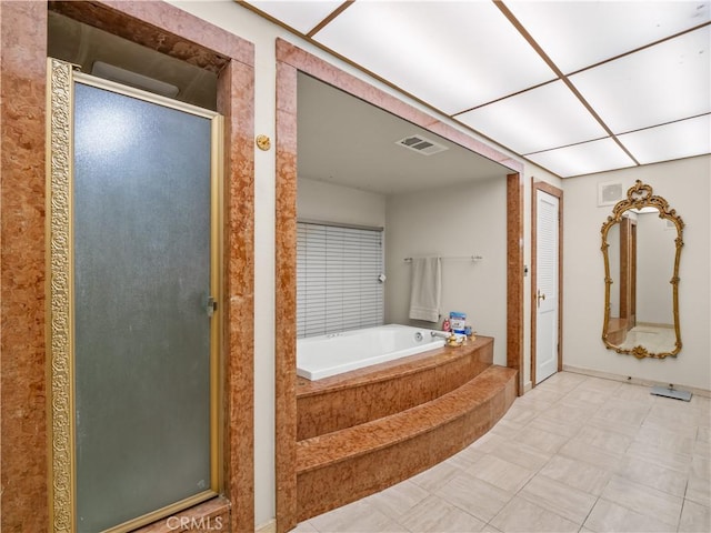 bathroom with separate shower and tub