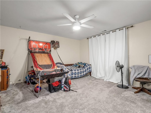 bedroom with ceiling fan and carpet floors