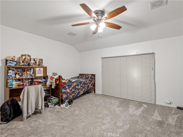 carpeted bedroom featuring ceiling fan and vaulted ceiling