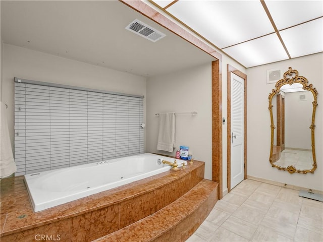 bathroom featuring tiled bath