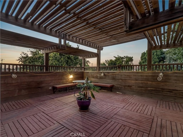 deck at dusk with a pergola