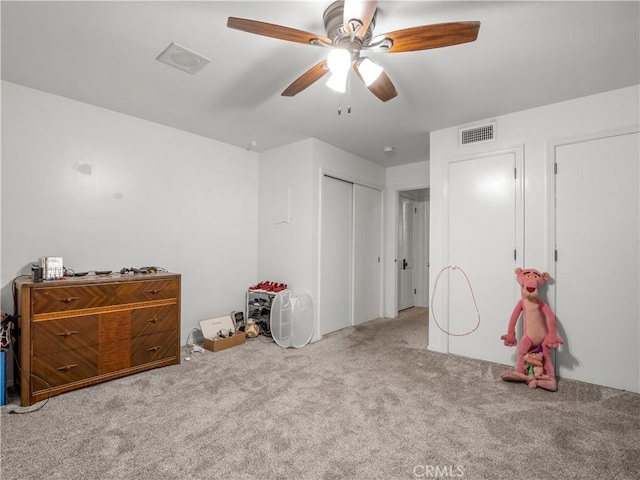 bedroom with ceiling fan, a closet, and carpet