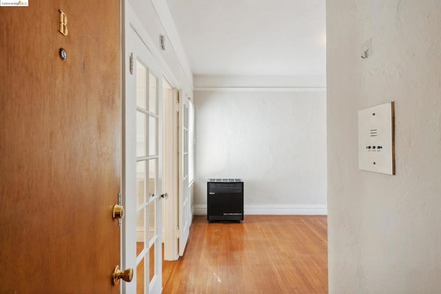 corridor featuring hardwood / wood-style floors