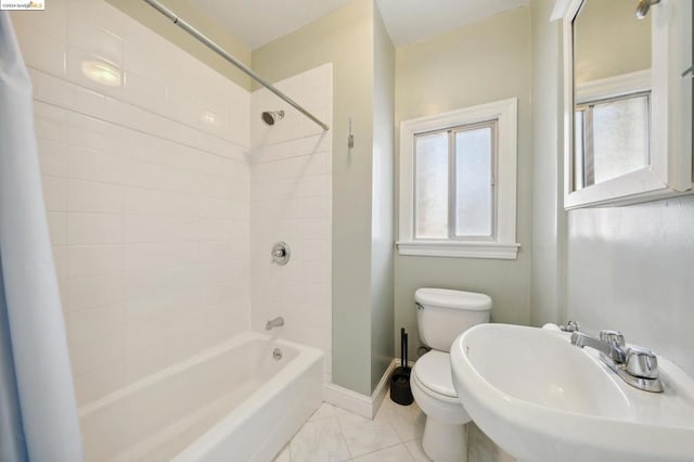 full bathroom featuring shower / bath combination with curtain, sink, and toilet