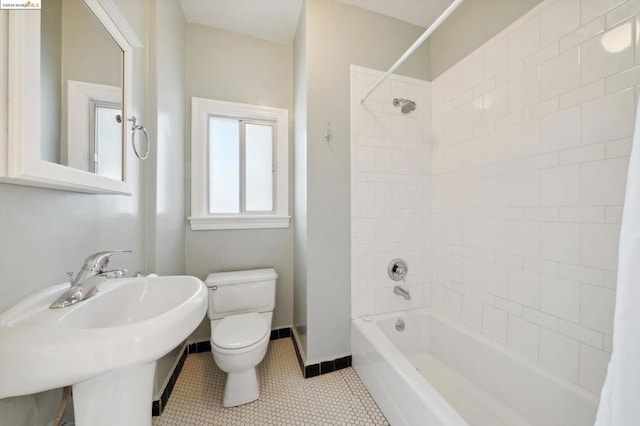 full bathroom with sink, tile patterned flooring, toilet, and shower / bathtub combination with curtain