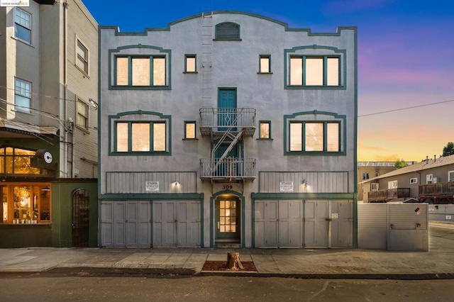 view of front of property with a balcony