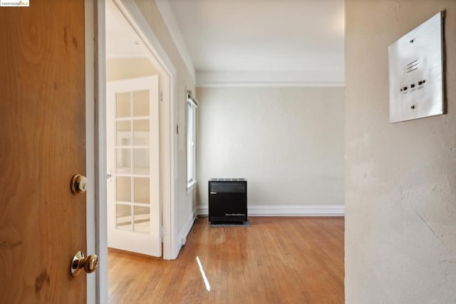 interior space with heating unit and light wood-type flooring