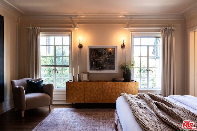 bedroom with ornamental molding, dark hardwood / wood-style flooring, and multiple windows