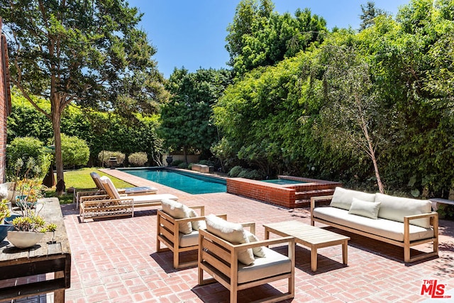 view of pool featuring an outdoor hangout area and a patio area