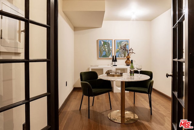 dining room with hardwood / wood-style floors