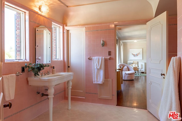 bathroom with tile walls