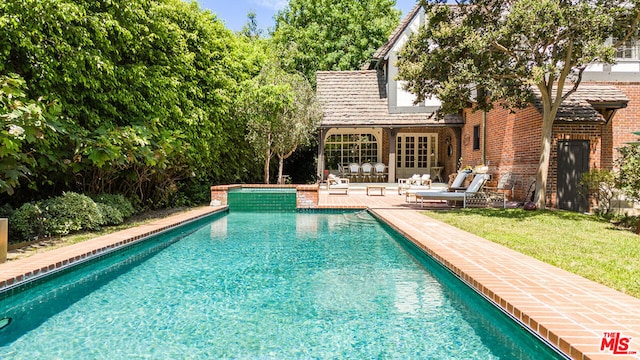 view of swimming pool with a patio area