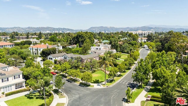 birds eye view of property with a mountain view