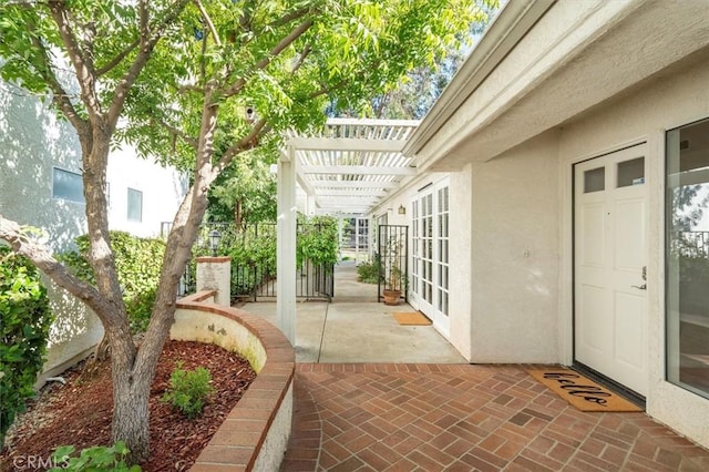 view of patio featuring french doors and a pergola