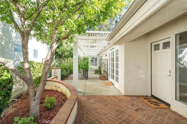 view of patio with fence and a pergola