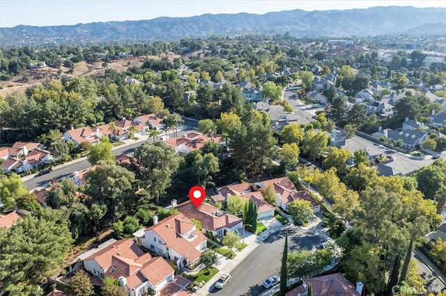 birds eye view of property featuring a mountain view and a residential view