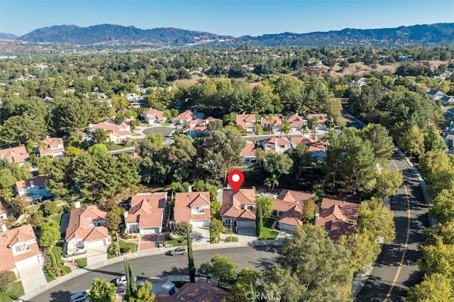 drone / aerial view featuring a mountain view and a residential view