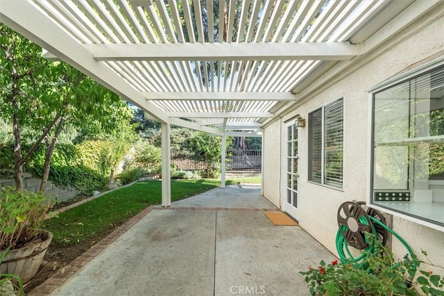 view of patio featuring fence and a pergola