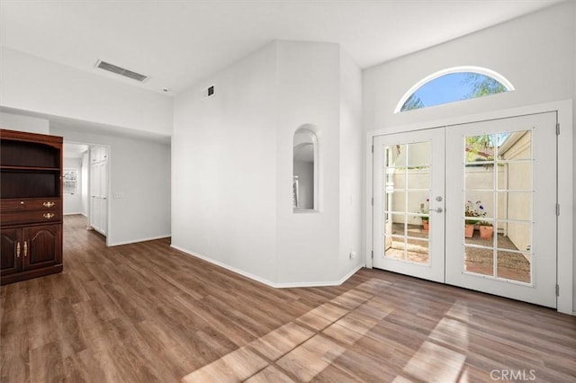 interior space featuring hardwood / wood-style floors and french doors