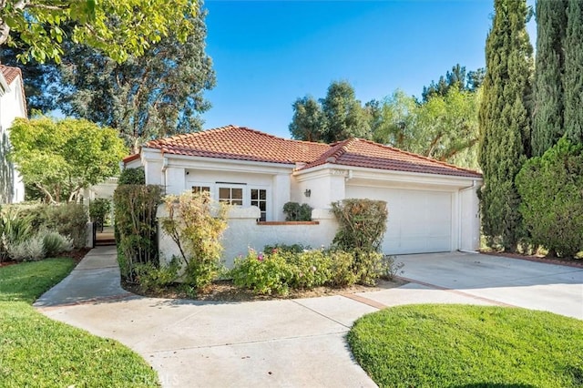 mediterranean / spanish-style house featuring stucco siding, concrete driveway, an attached garage, and a tile roof