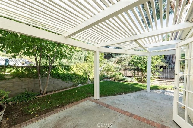 view of patio with a pergola and fence