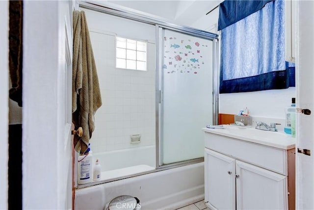 bathroom featuring shower / bath combination with glass door and vanity