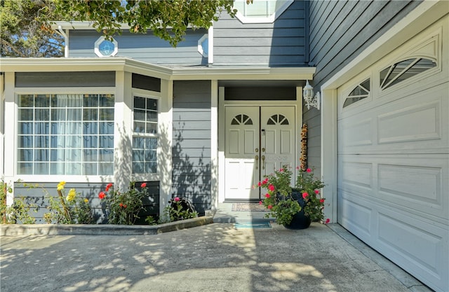 view of exterior entry featuring a garage