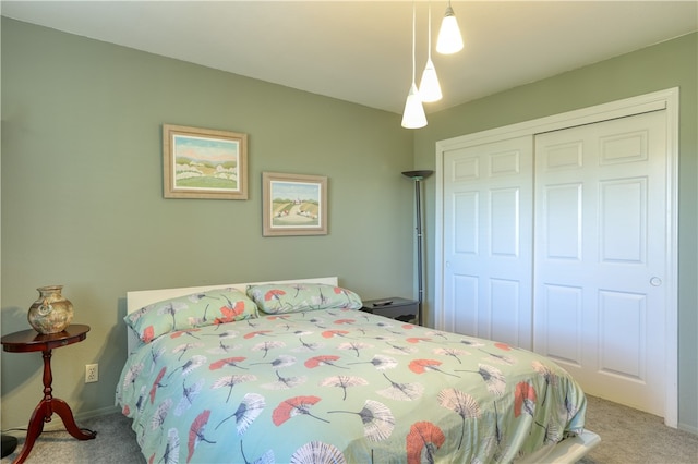 bedroom featuring a closet and carpet flooring