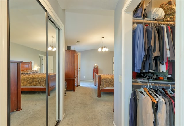 interior space with vaulted ceiling and an inviting chandelier