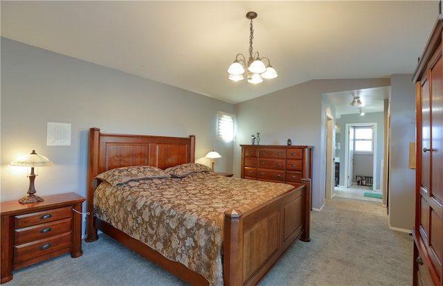 carpeted bedroom featuring a notable chandelier, a closet, and vaulted ceiling