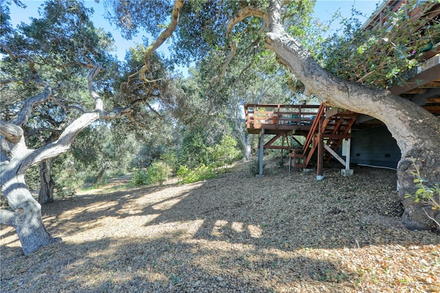 view of yard featuring a wooden deck