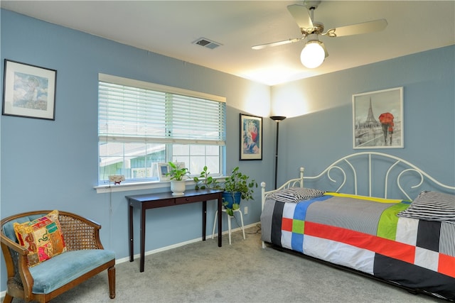 bedroom with ceiling fan and carpet floors