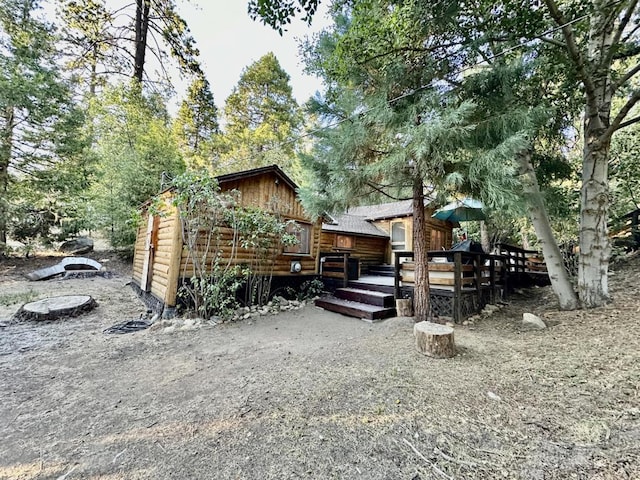 view of home's exterior with a wooden deck