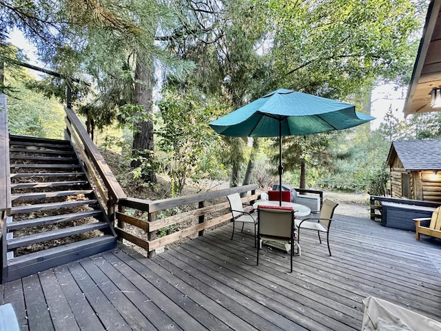 wooden terrace with a storage unit