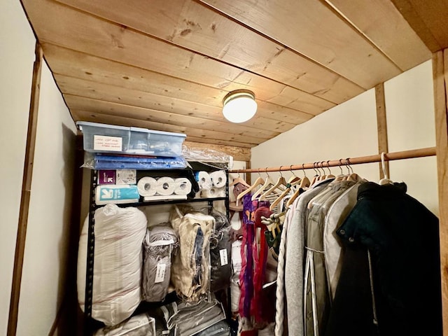 walk in closet featuring vaulted ceiling