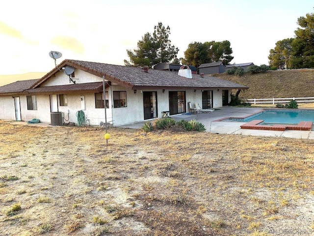 back of property with a patio area