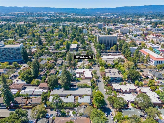 birds eye view of property with a mountain view