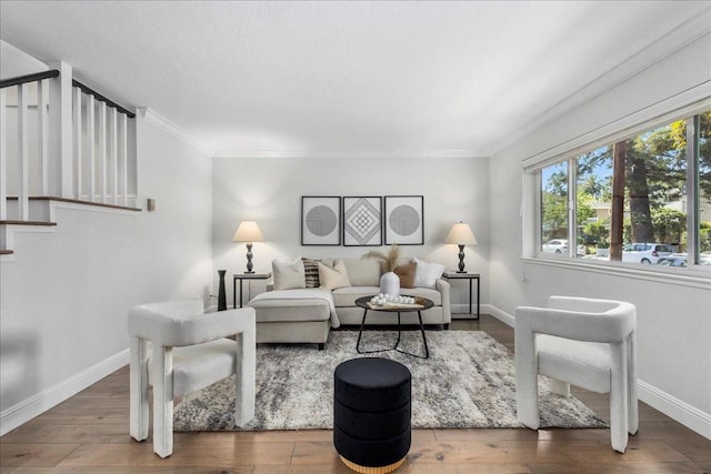 living room with hardwood / wood-style floors and ornamental molding