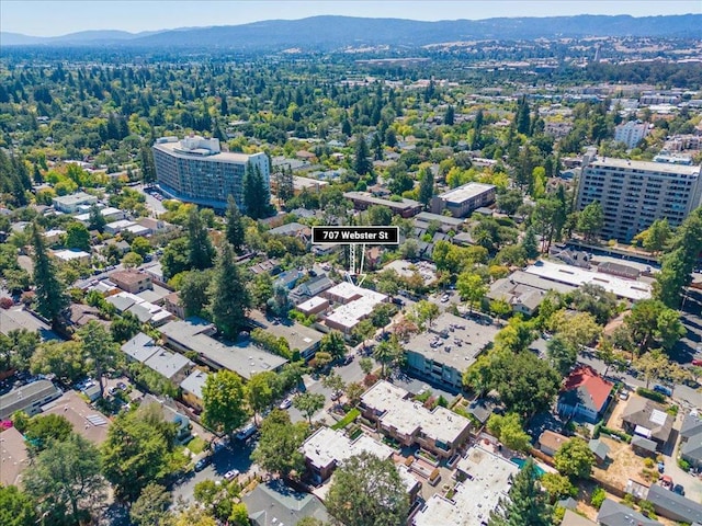 birds eye view of property with a mountain view