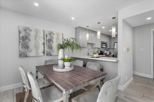 dining space featuring sink