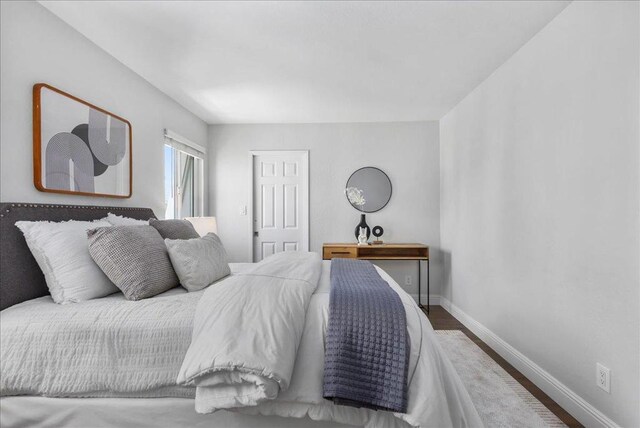 bedroom with wood-type flooring